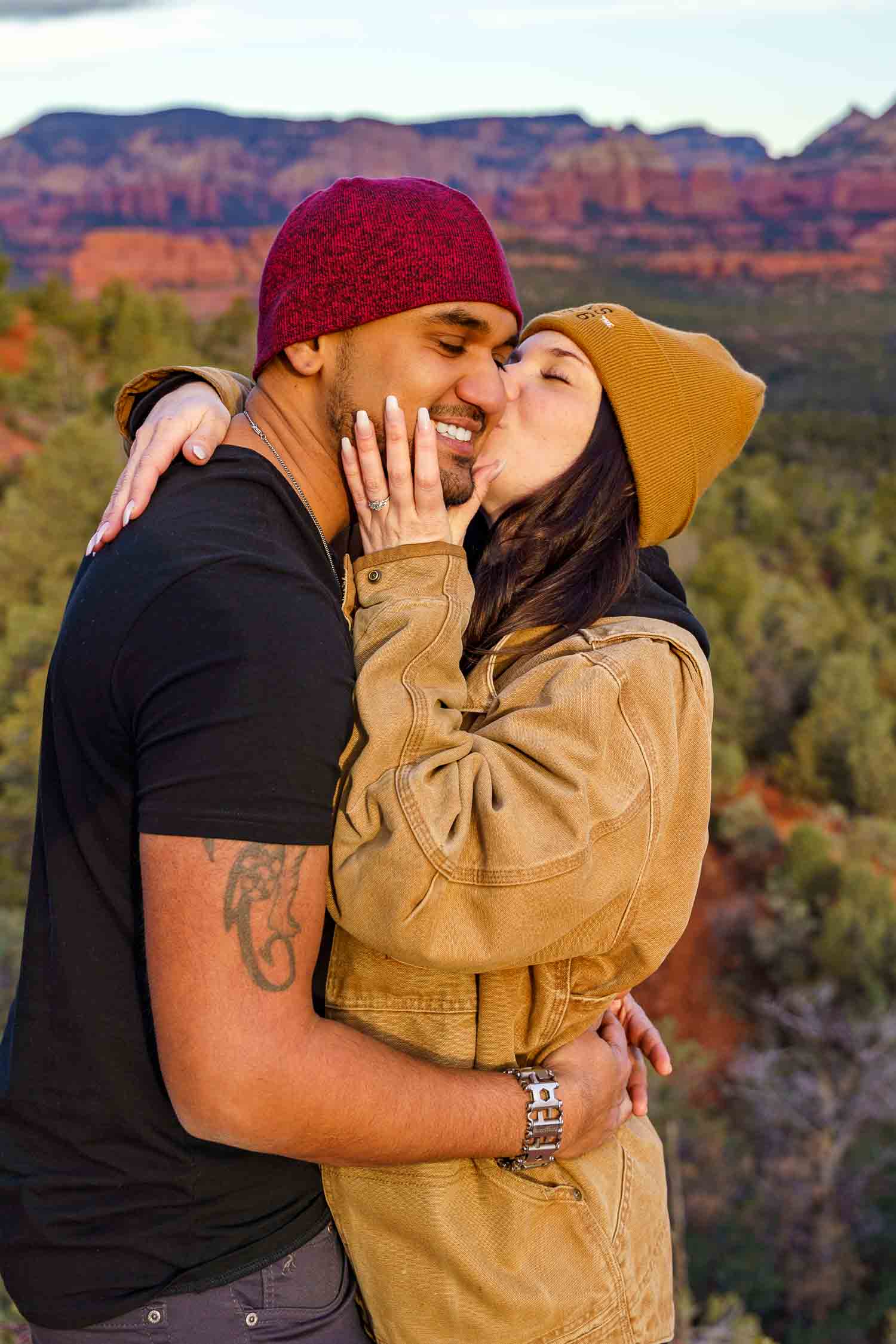 laughing-couple-proposal-sedona A couple kissing after a succesful proposal.