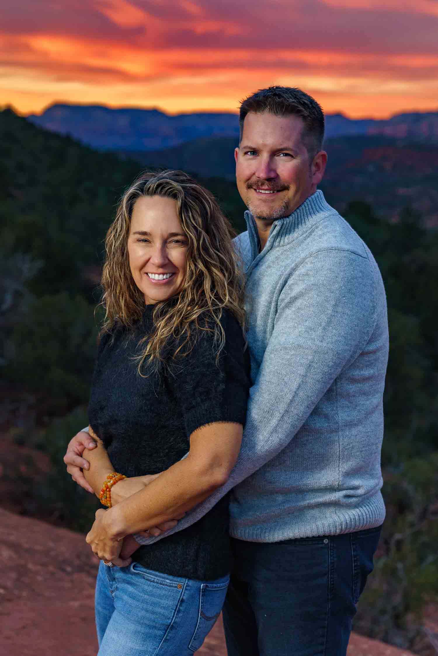 sunrise photo of a couple proposing at devils bridge in Sedona, Arizona